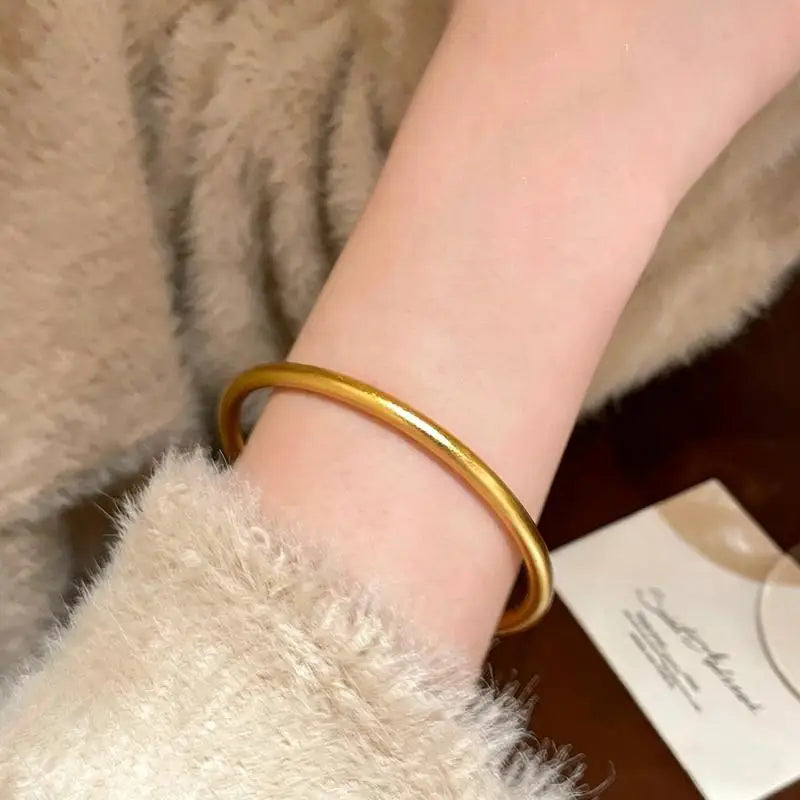 Women Bracelet in Elegant Gold Round Minimalist Design Perfect for Classic Fashion